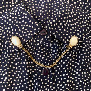 Vintage sweater clip gold tone with pearlescent bead ends and chain connector